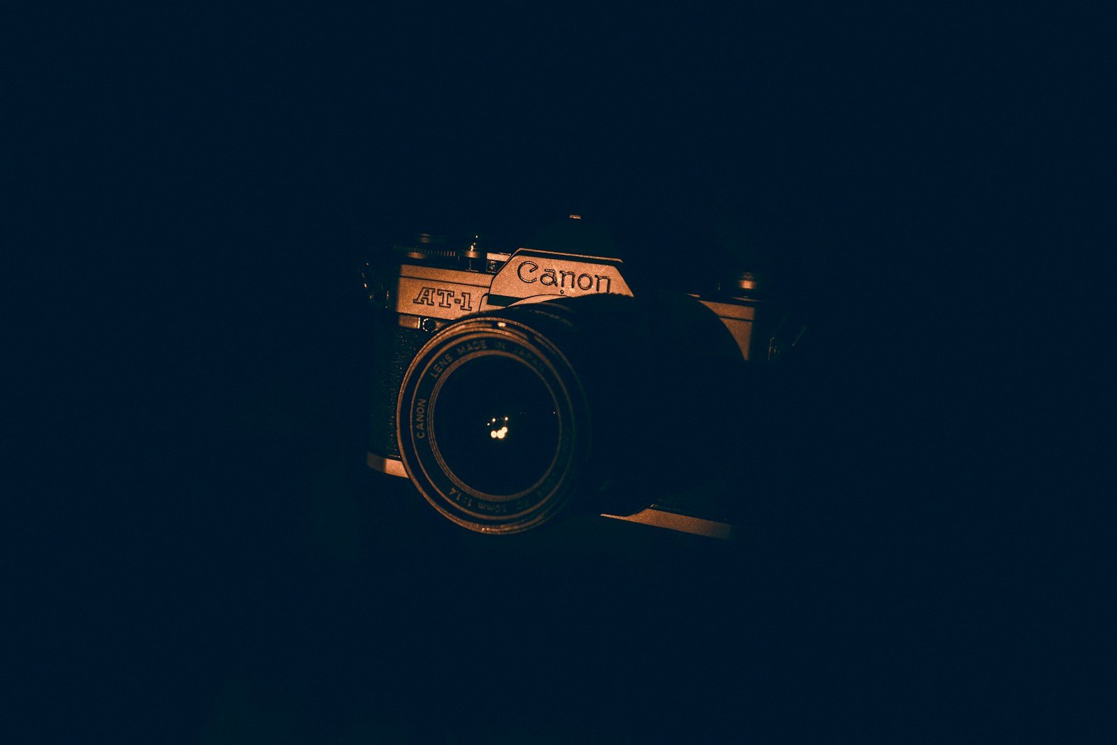 black and silver Canon bridge camera